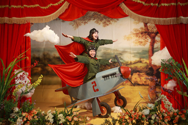 A couple posing with a plane