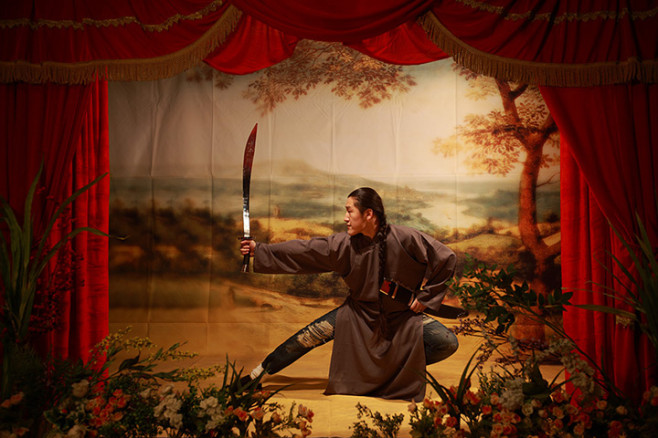 A man posing with a large knife
