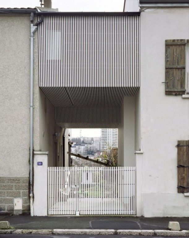 Suspended-Room-Addition-Gentilly-France-NeM-Architectes-Remodelista-611x768