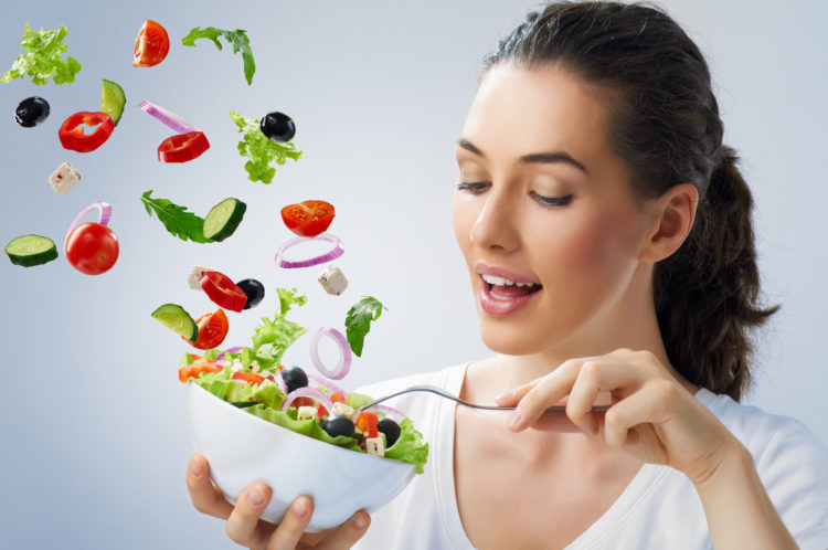 A beautiful girl eating healthy food