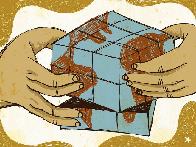 Human hands playing with a puzzle with a pattern of the globe on it