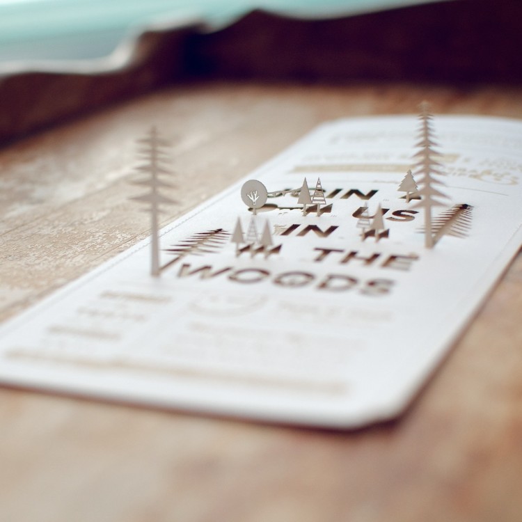 Laser-cut cover stock sewn to laser-cut kraft paper. Blog post: http://christineandian.tumblr.com/post/8722900564/invitations